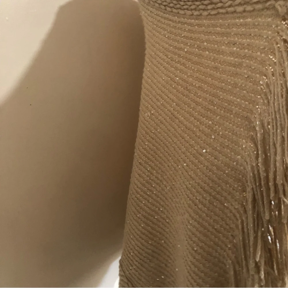 Tan knitted metallic gold fringe hem poncho